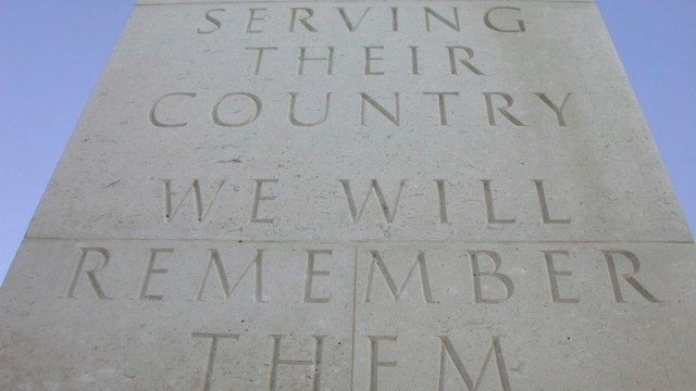 Inscription on the National Services Memorial at The National Memorial Arboretum, "They died serving their country. We will remember them"
